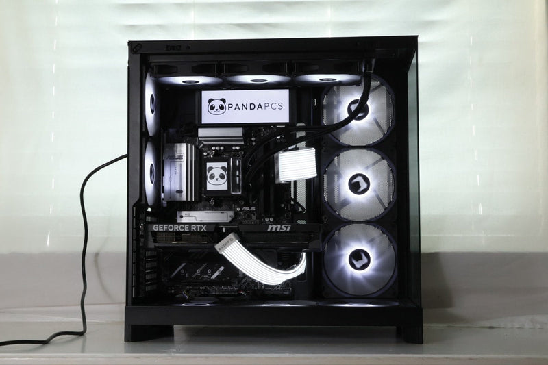 An RTX 5070 Ti installed in a PandaPCs build, shown alongside dual LCD screens